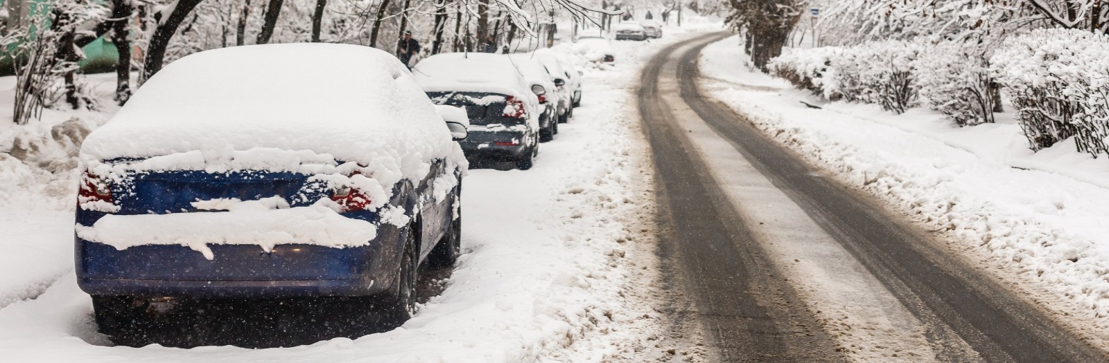 Cars parked on snowy road