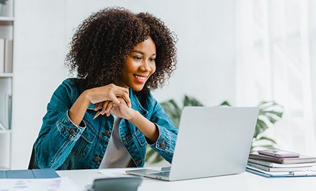 Person sitting at a computer looking at the screen