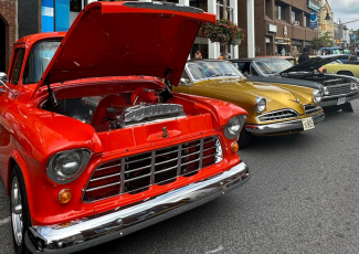 classic red car with hood open