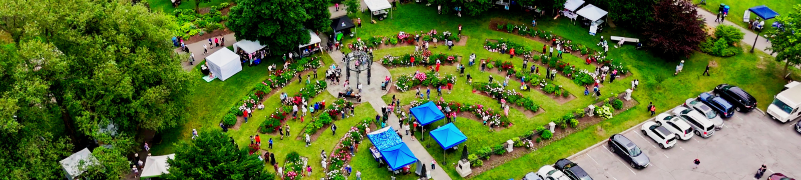 Satellite image of Peony Festival garden grounds with people and vehicles.