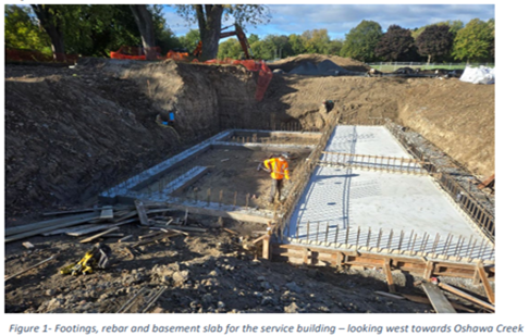 Footings, rebar and basement slab for the service building - looking west towards Oshawa Creek