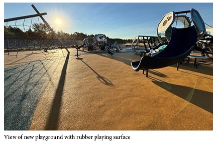 View of new playground with rubber playing surface