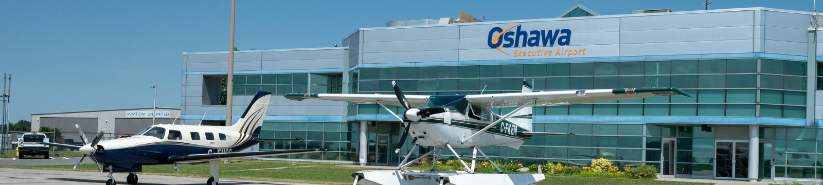 Oshawa Executive Airport with planes in front